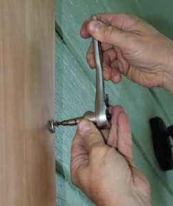 Installing plywood window storm shutters