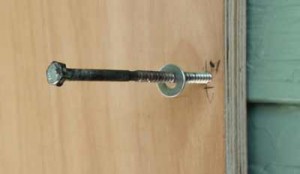 Installing plywood window storm shutters