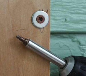 Installing plywood window storm shutters